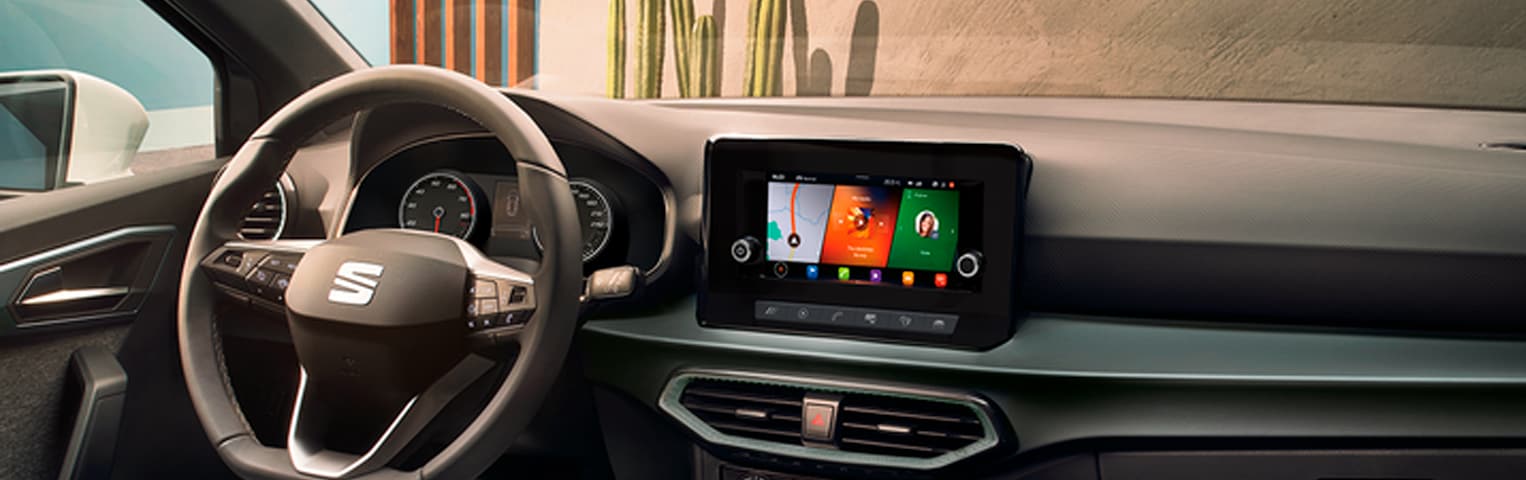 SEAT Ibiza Xcellence 2018 detailed interior technology. Interior front car image with men and woman