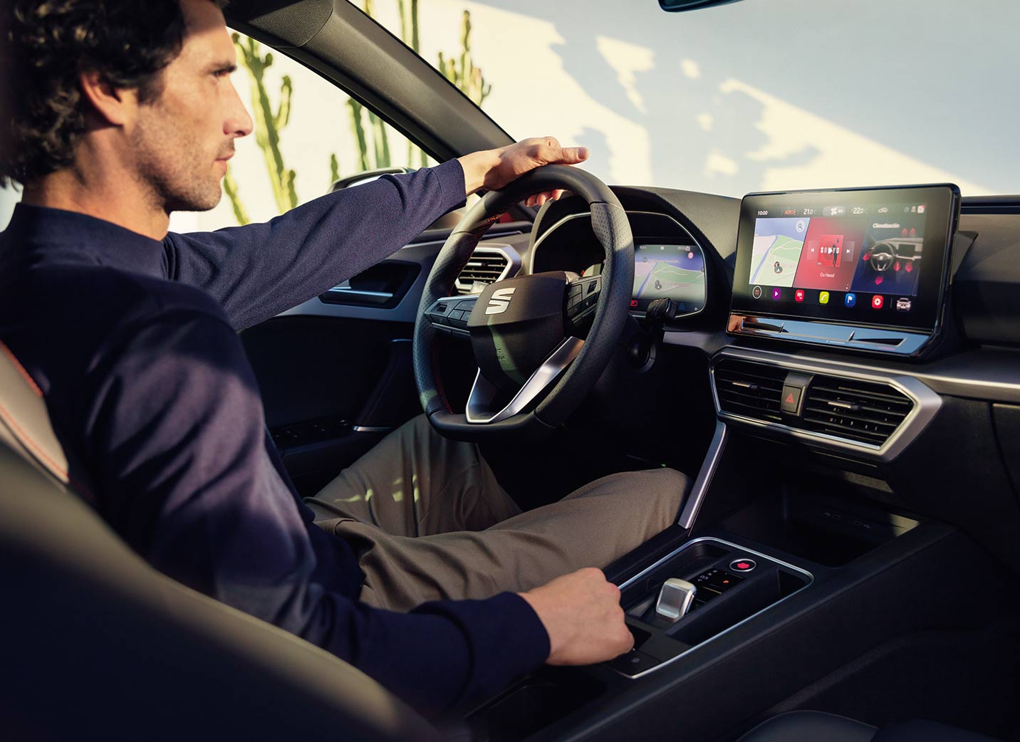 Side view of a driver in a SEAT car taken from the passenger place