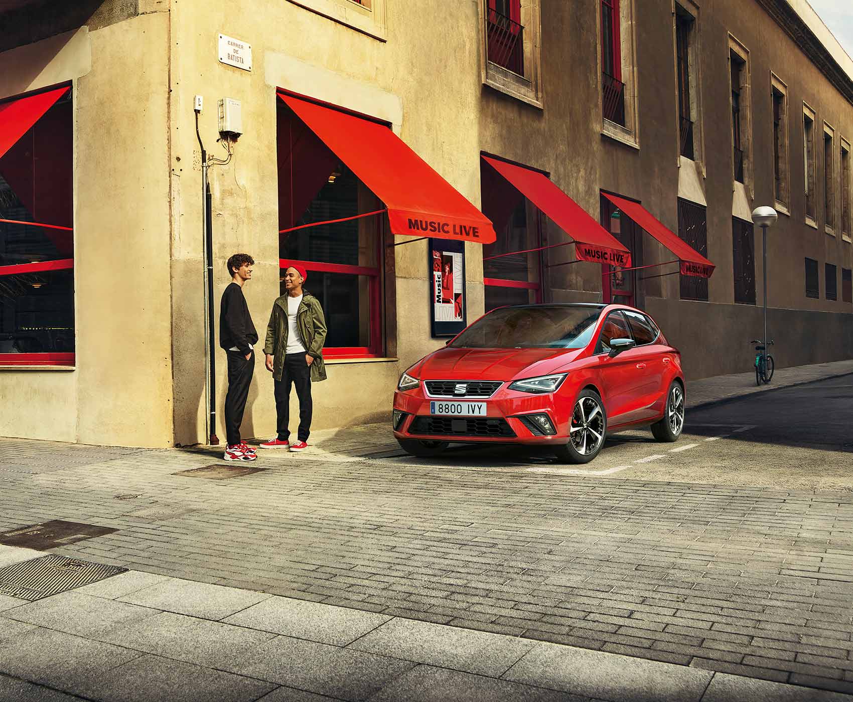 two-friends-in-front-side-view-of-the-red-seat-Ibiza